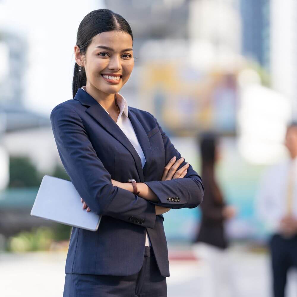 professional business woman arms crossed and smiling